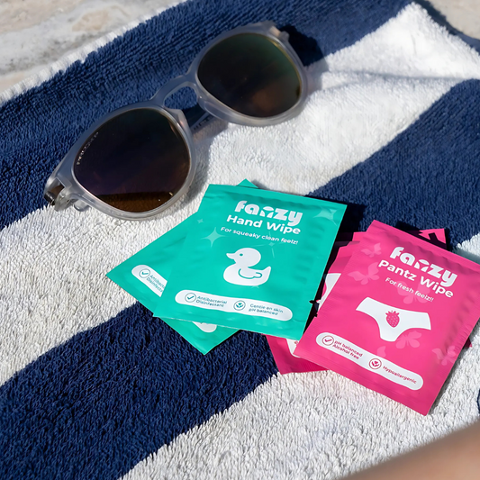 Wipes and sunglasses on towel